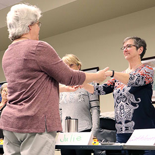 A CAPCOG instructor teaches volunteers how to instructor older adults to better balance themselves in an effort to prevent falls.