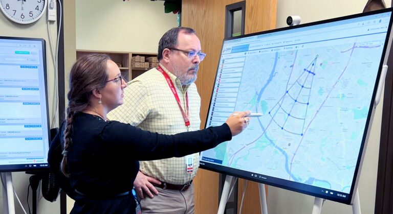 Martin and Olivia looking at WebEOC during the regional exercise in 2022