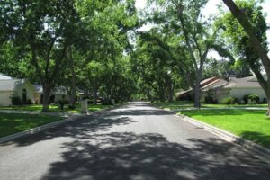 A tree lined street in Meadowlakes, Texas.