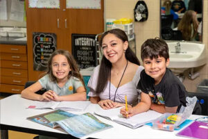 A teacher and two students.